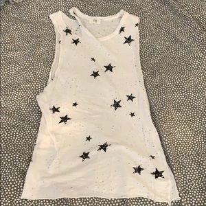 White distressed top with black stars